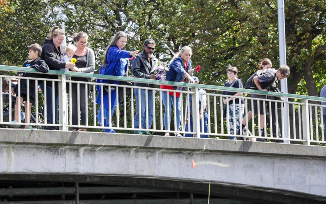 People at a memorial to mark the 13th anniversary of the 2011 Christchurch quake.