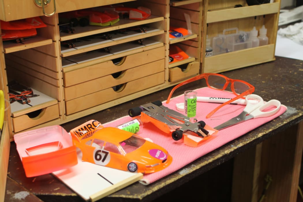 An image of the club worktable with a slot car on it ready for running repairs.