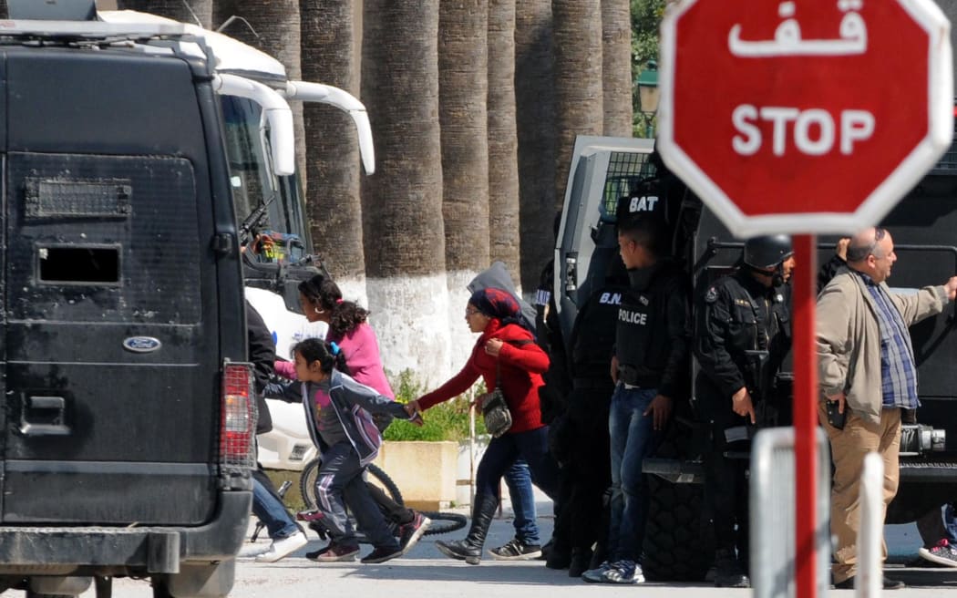 Tourists are evacuated by special forces from the Bardo Museum