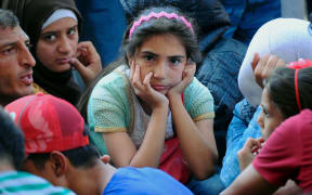 Migrants are seen outside the Eastern (Keleti) railway station in Budapest on September 1, 2015. Hungarian authorities closed the station earlier.