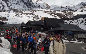 On a busy day, the Whakapapa ski area on Mount Ruapehu hosts thousands of visitors, seen here leaving the field at the end of a fine day.