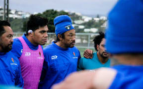 Manu Samoa coach Seilala Mapusua, captain Michael Alaalatoa and assistant coach Tana Umaga listen in during training.