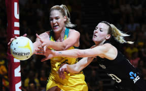 Diamonds goal shooter Caitlin Bassett (L) Silver Ferns defender Katrina Rore (R)
