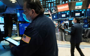 A trader works on the floor of the New York Stock Exchange (NYSE) on 20 December 2021.