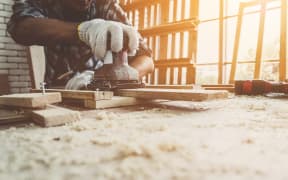 A carpenter working in a workshop.