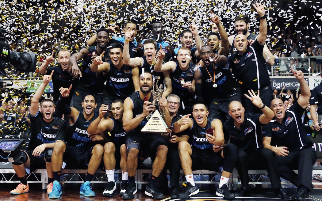 The Breakers celebrate with the ANBL trophy after winning the finals series 2-0 against the Taipans.