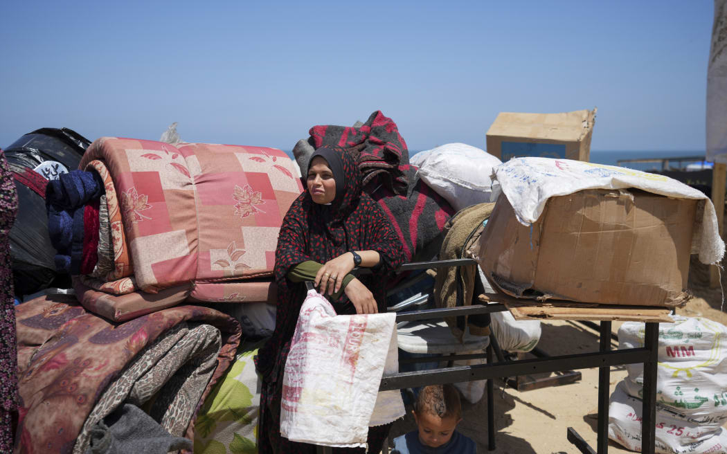 Displaced Palestinians arriving in central Gaza after fleeing from the southern Gaza city of Rafah to Deir al Balah in the Gaza Strip, on 9 May, 2024.