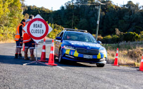 The scene where the Police have put a cordon in place close to the spot on Te Anga Road where Tom Phillips was shot dead by Police.