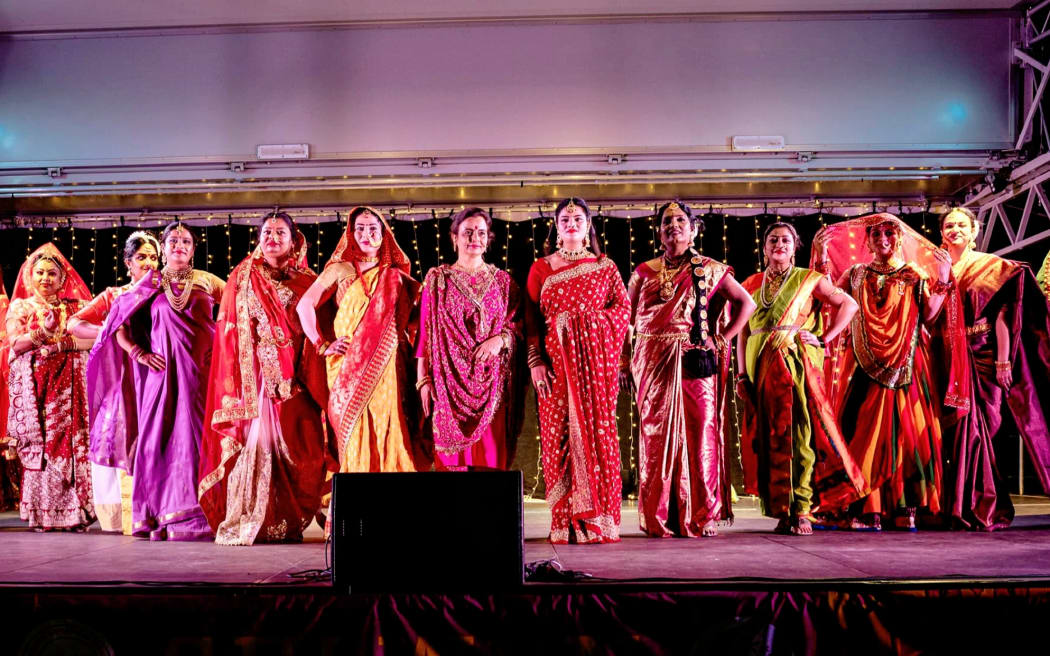 Indian women showcase the traditional bridal attire of the South Asia nation's different regions during Diwali celebrations in Selwyn, Canterbury.