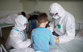Medical workers in Russia's National Medical Research Center for Children's Health where children with COVID-19 coronavirus infection are treated, in Moscow.