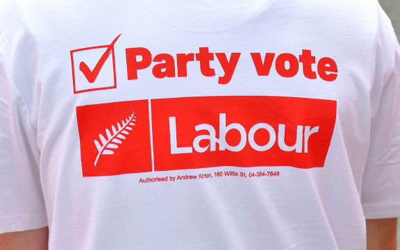 A young Labour supporter waits for the leader of the Labour Party Jacinda Ardern to arrive during a visit to a medical centre on the Labour Party's campaign trail in Wellington on September 19, 2017.