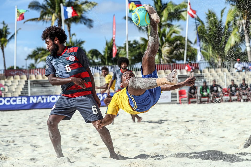 Solomon Islands James Naka does a bicycle kick during their opening match against New Caledonia at the OFC Beach Soccer Nations Cup 2019.