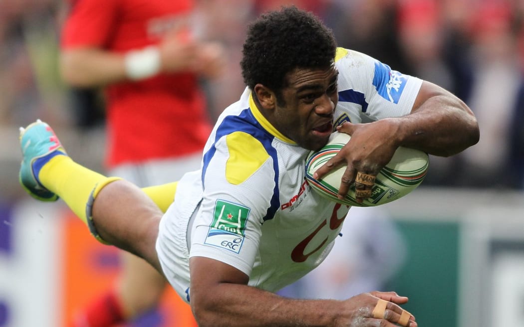 Fiji's Clermont Wing Napolioni Nalaga scores a try