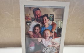 A photo of Kain Parsons and his children has been placed at the front of the room where the inquest into his 2018 death is being held.