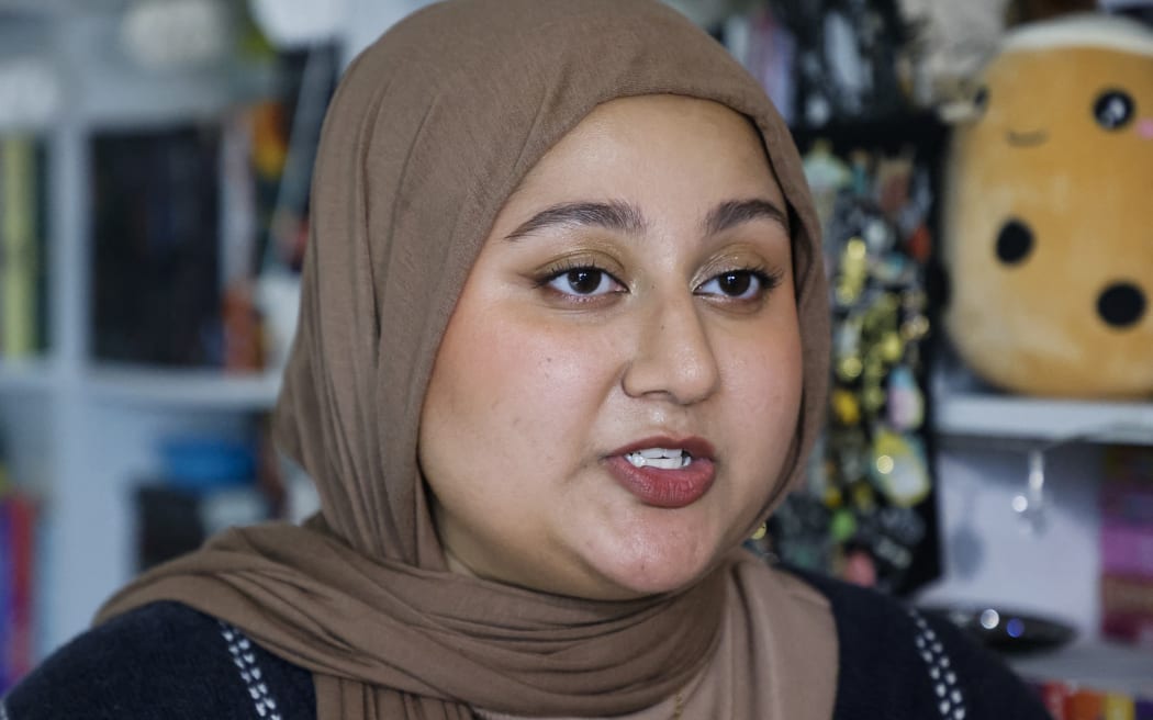 TikTok influencer Ayman Chaudhary speaks during an interview at her home in Naperville, Illinois, on April 27, 2024. - Chaudhary, who began posting book reviews on TikTok's #BookTok platform in in August 2020, has grown to be one of the top influencers and has developed a business reviewing books. "If TikTok gets banned my plan would be to transition to Instagram and Youtube," says Ayman Chaudhary, one of the millions of content creators worried about the US banning their favorite app. (Photo by TANNEN MAURY / AFP)