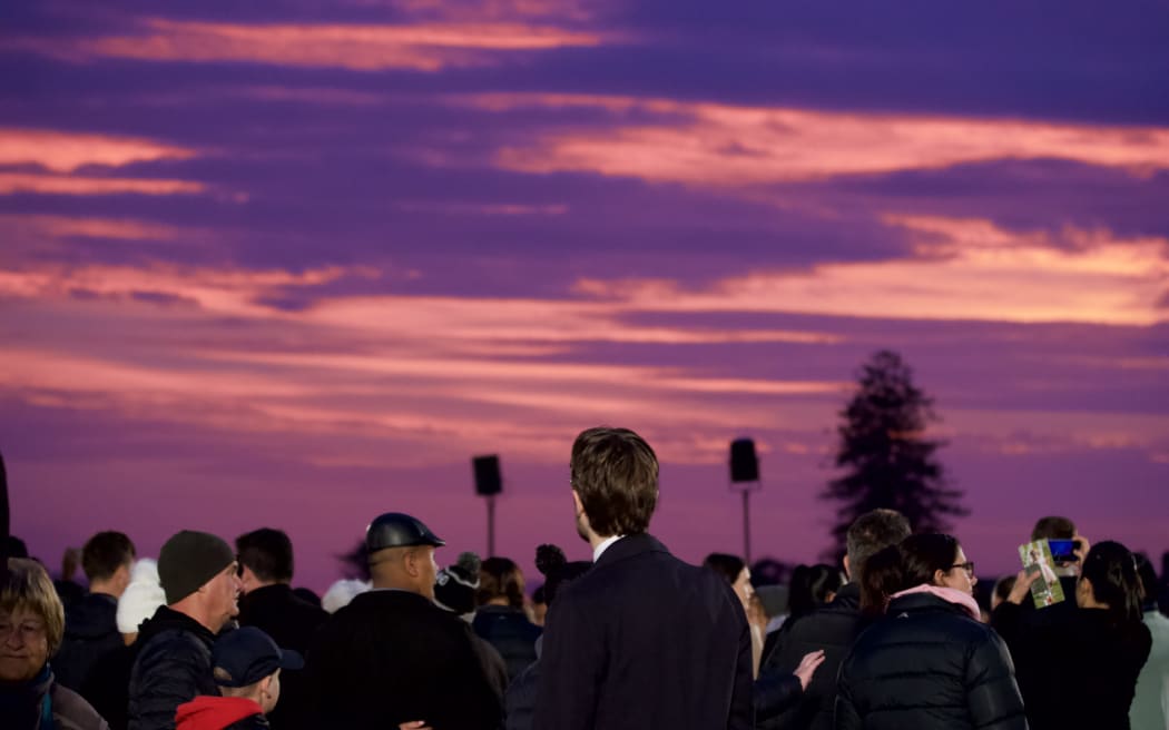 The sun rises following the dawn service in Auckland
