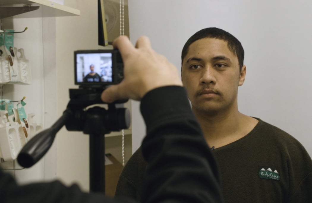 Piripi getting his passport photo taken