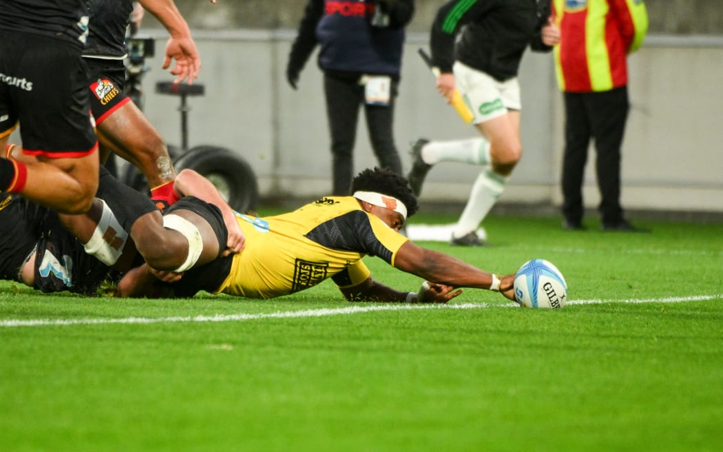 Peter Lakai scores a try for the Hurricanes against the Chiefs.