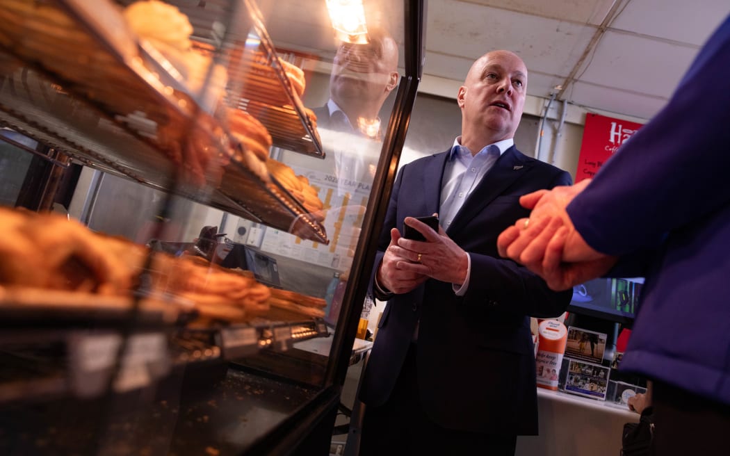 National Party leader Christopher Luxon selecting a pie at Rays Pies & Fries while campaigning in Kāpiti, Paraparaumu on 11 September, 2023.