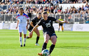 Katie Kitching of New Zealand scores a penalty goal during their international friendly win over Thailand.