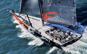 This handout image taken and received from Rolex on December 26, 2024 shows the yacht Master Lock Comanche competing at the start of the annual Sydney to Hobart yacht race on Boxing Day on Sydney Harbour. (Photo by Carlo Borlenghi / ROLEX / AFP) / RESTRICTED TO EDITORIAL USE - MANDATORY CREDIT "AFP PHOTO / ROLEX" - NO MARKETING - NO ADVERTISING CAMPAIGNS - DISTRIBUTED AS A SERVICE TO CLIENTS