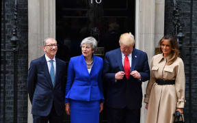 Britain's Prime Minister Theresa May and her husband Philip May greet US President Donald Trump and US First Lady Melania Trump.