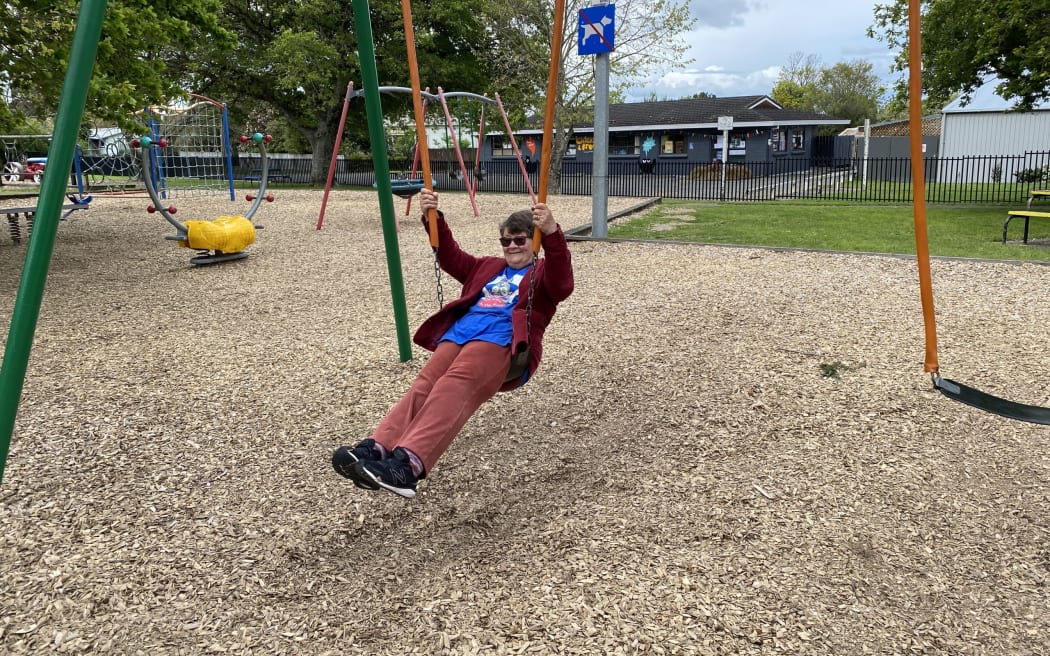 Joy Cowley enjoying the swings at the Featherston playground which will soon bear her name. PHOTOS/SUE TEODORO