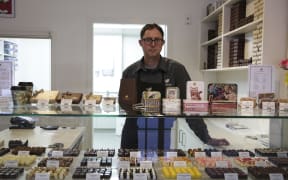 The Chocolate Story's director Brett Nicholls is asking the Hutt City Council for compensation.