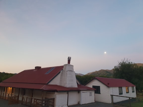 Dawn breaks over an old cob building at Tarndale, Molesworth Station