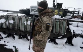shows soldiers from the 93rd Kholodny Yar Brigade stand guard after they ambushed a Russian column in the north of Kharkiv region.