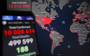 A world map of the COVID-19 coronavirus cases by the Center for Systems Science and Engineering at Johns Hopkins University is seen on 28 June, 2020.