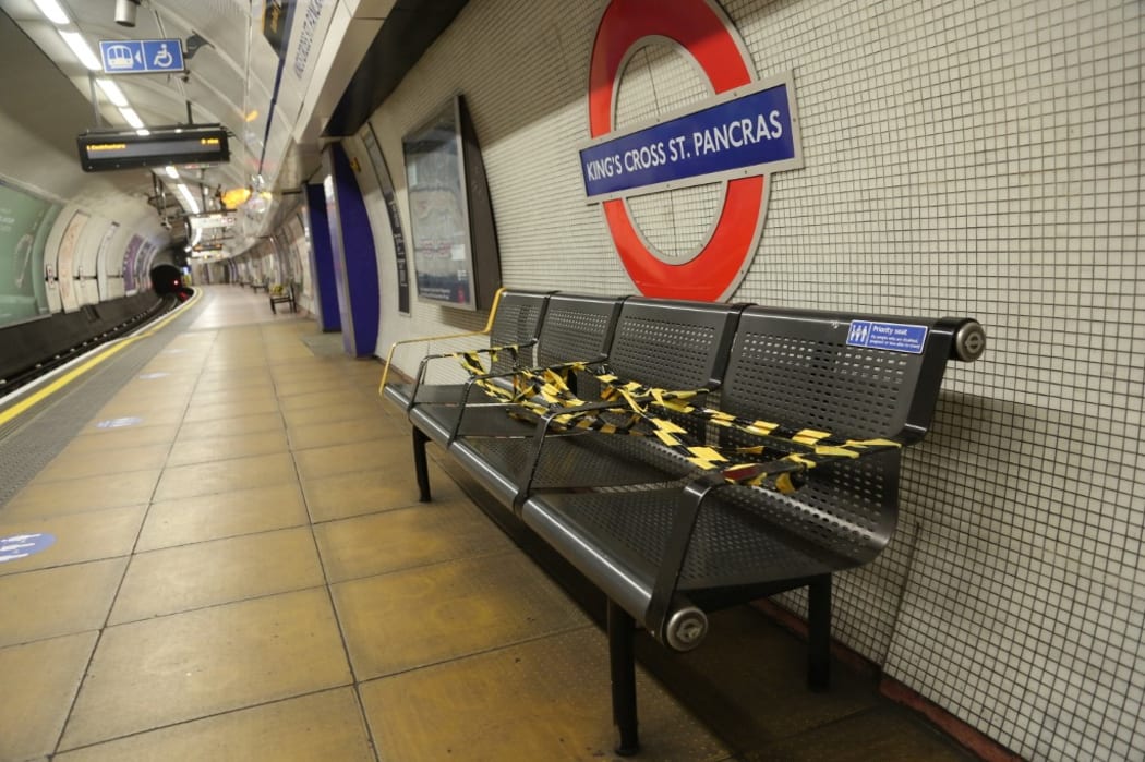 Benches are covered with tapes in an underground station to enforce social distancing  as a precaution against Coronavirus (Covid-19) infection in London.