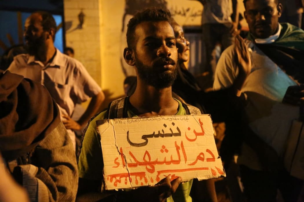 Sudanese demonstrators gather to commemorate for people who lost their lives in 2019's protests demanding a civilian transition government, in Khartoum, Sudan.