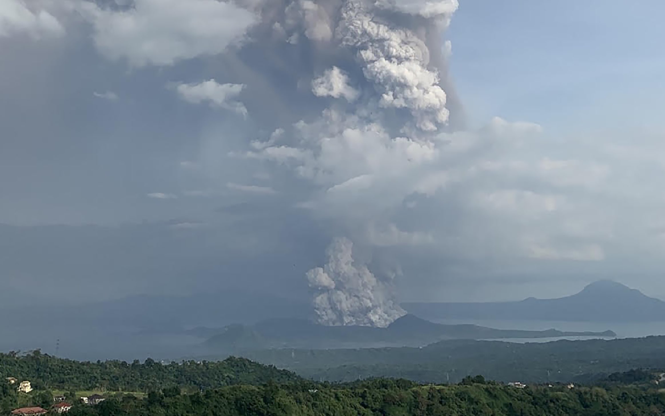 A phreatic explosion from the Taal volcano is seen from the town of Tagaytay in Cavite province, southwest of Manila, on January 12, 2020.