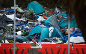 Tents and rubbish litter Parliament grounds after clashes between police and protesters yesterday.