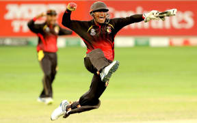 PNG keeper Kipling Doriga celebrates a wicket