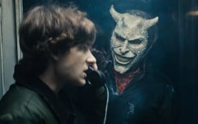 Mason Thames and Ethan Hawke in a scene from the film Black Phone 2.