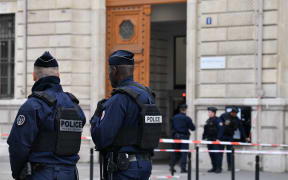 Police and military personnel block the bridge near Paris Police headquarters after four officers were killed in a knife attack on October 3, 2019 in Paris, France.