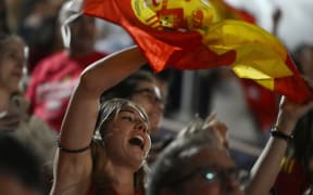 Spain fans celebrate their team's win as they watch a live broadcast of the Women's World Cup final football match between Spain and England, at the Palacio de los Deportes pavilion in Madrid on 20 August 2023.