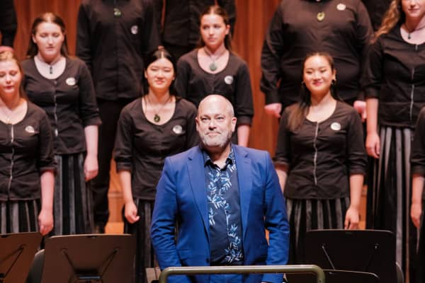 David Squire directing the NZ Youth Choir at the Sydney Opera House in December 2022.