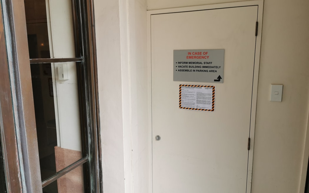 An earthquake-prone building notice inside the Carillon.