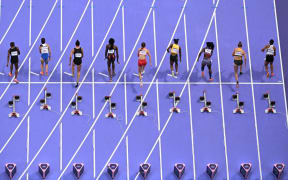 Trinidad and Tobago's Leah Bertrand, Czech Republic's Karolina Manasova, New Zealand's Zoe Hobbs, Britain's Daryll Neita, Canada's Audrey Leduc, Jamaica's Tia Clayton, US' Twanisha Terry, Germany's Gina Lueckenkemper and Belgium's Delphine Nkansa take the start in the women's 100m semi-final of the athletics event at the Paris 2024 Olympic Games at Stade de France in Saint-Denis, north of Paris, on August 3, 2024. (Photo by Antonin THUILLIER / AFP)