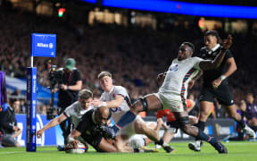 Mark Tele'a of New Zealand scores against England, 2024.