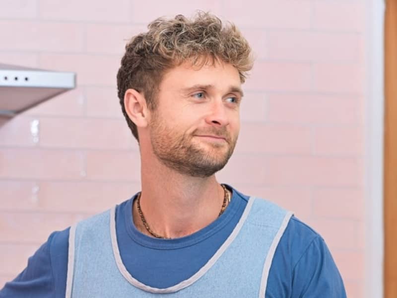 Hercules Noble smiled slightly and looks sideways.