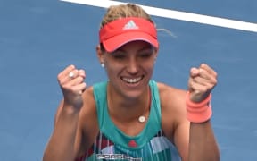 Germany's Angelique Kerber celebrates her win against Belarus's Victoria Azarenka at the 2016 Australian Open on January 27, 2016. AFP PHOTO / PAUL CROCK
