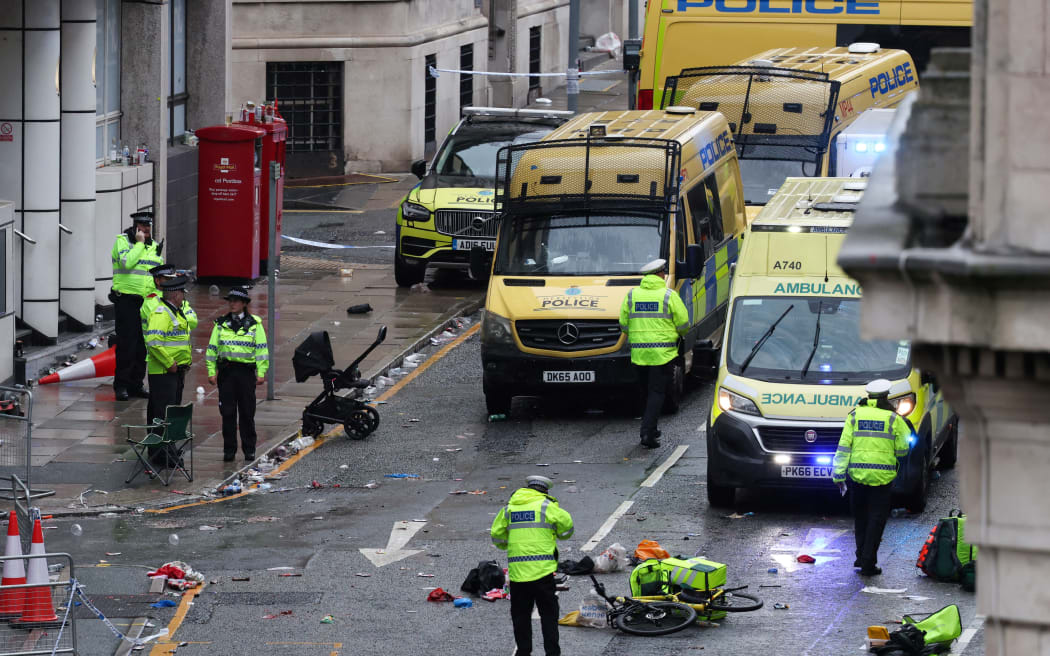 Police at the scene where a car hit pedestrians during Liverpool's Premier League title celebrations in the city centre, 26 May 2025.