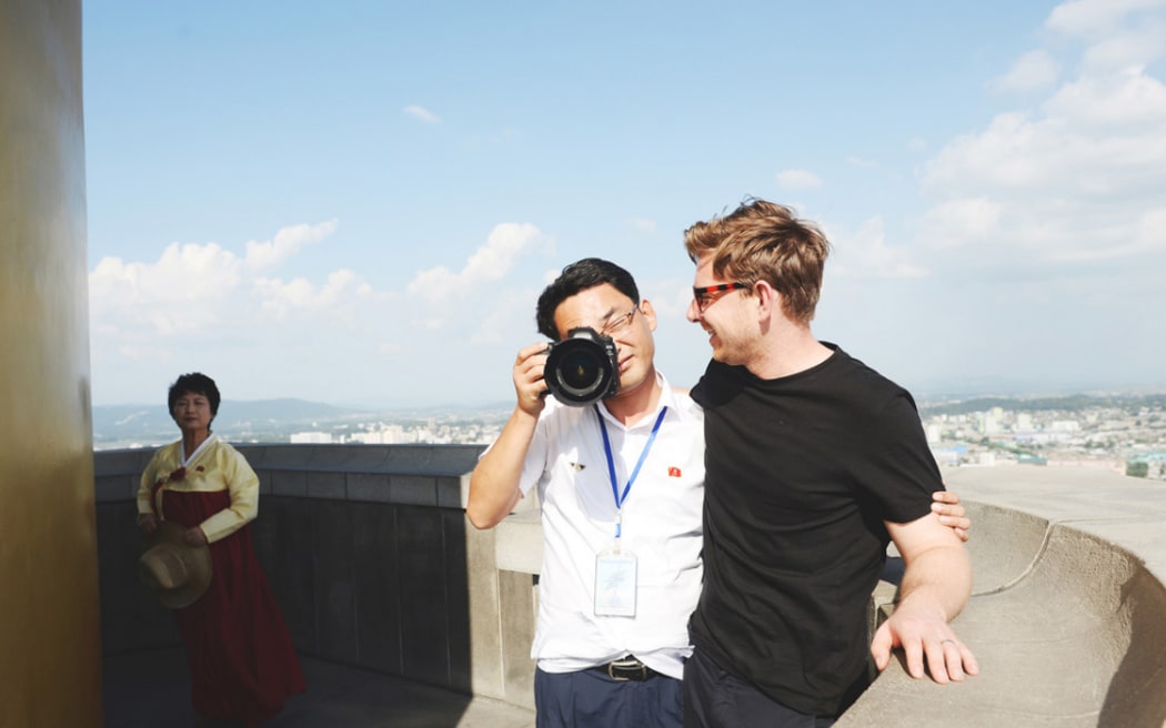 Architect photographer Dave Kulesza (right) and one of his guides in North Korea.