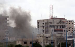 Smoke can be seen from one of three bombs in Tartous on the coast of Syria. Four locations in the city of Jableh, further north, were also bombed.