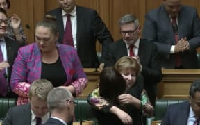 MP Clare Curran is congratulated by fellow MPs after her valedictory speech on Tuesday.
