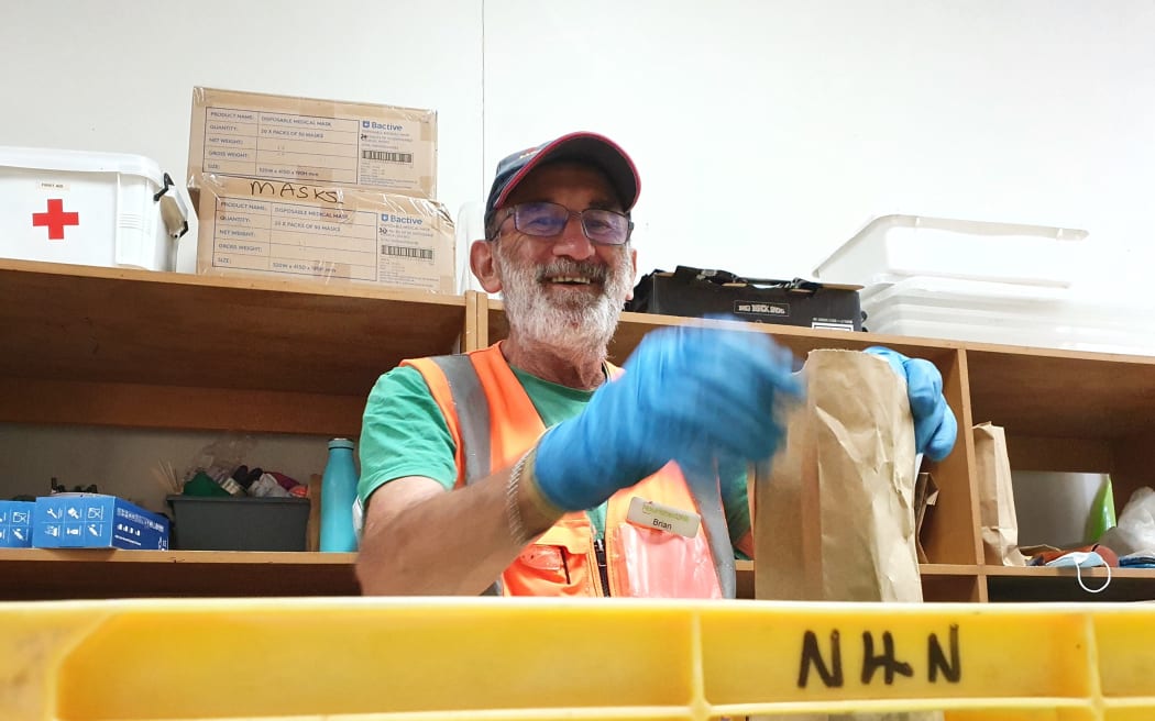 Volunteer packing rescued food at Nourished for Nil food rescue charity